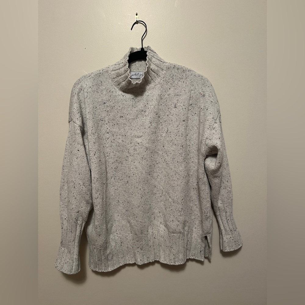 White and black speckled turtleneck oversized